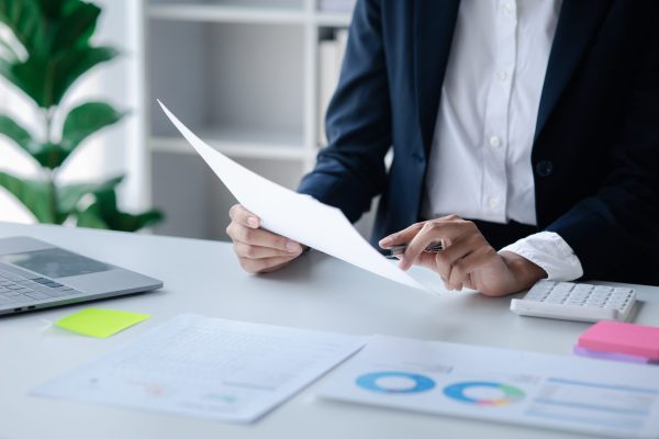 a-female-financier-is-reviewing-company-financial-2023-11-27-05-29-55-utc