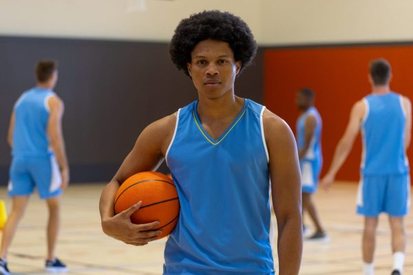 portrait-of-biracial-male-basketball-player-wearin-2023-11-27-05-18-44-utc-scaled